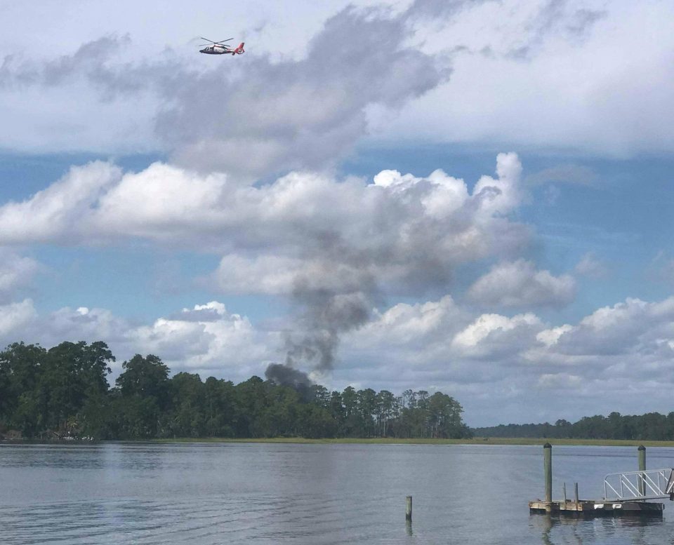  Smoke billows from the crash site in South Carolina, US