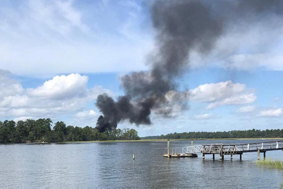  Dramatic photos showed black plumes of smoke billowing into the sky, moments after the jet crashed