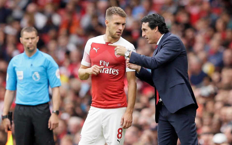 Unai Emery gives Aaron Ramsey instructions from the touchline