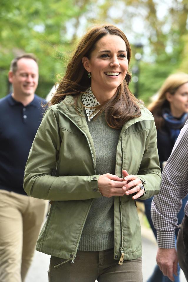 The duchess wore a khaki green Fjällräven jacket, a silk Joseph and Penelope Chilvers shirt, and riding boots