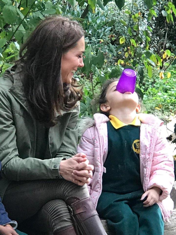 Kate Middleton laughed as the student clowned around with a cup