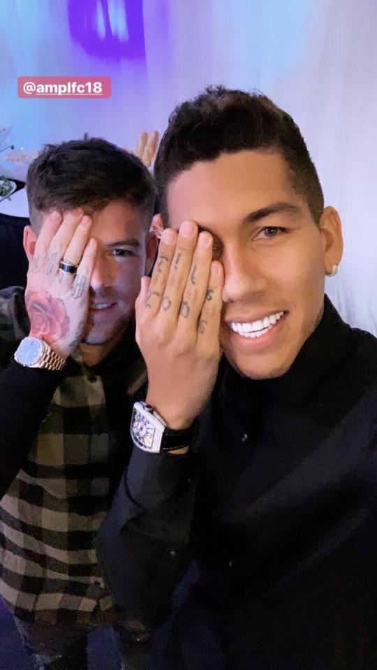 Alberto Moreno seemed to enjoy himself at the party - here he is with one of the birthday boys copying a goal celebration