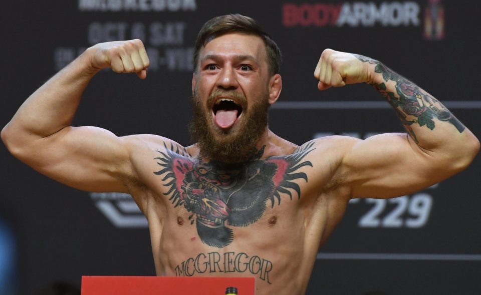 Conor McGregor poses during Friday's heated weigh-in