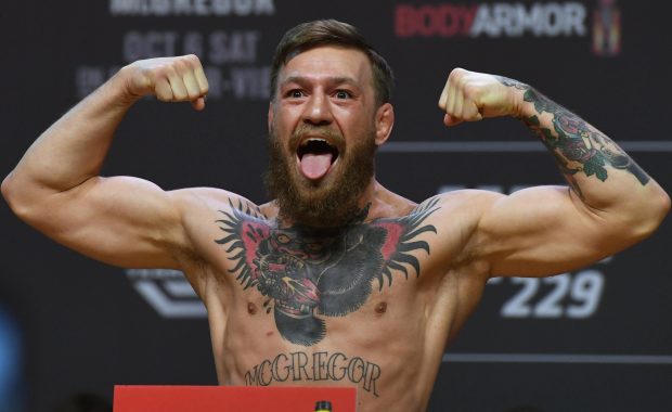Conor McGregor poses during Friday's heated weigh-in