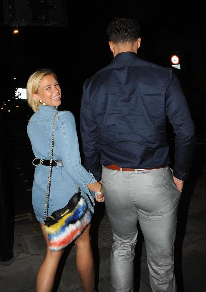 Gabby flashed a smile for the cameras as she made her way out of the venue