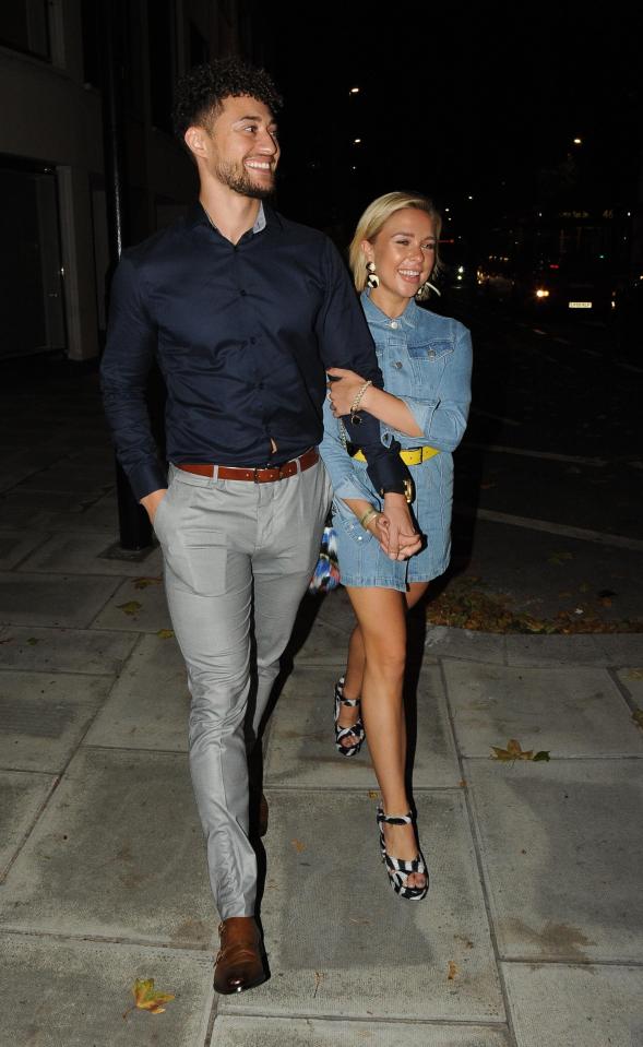  Gabby Allen clutched on to her boyfriend's arm as they left a charity boxing match