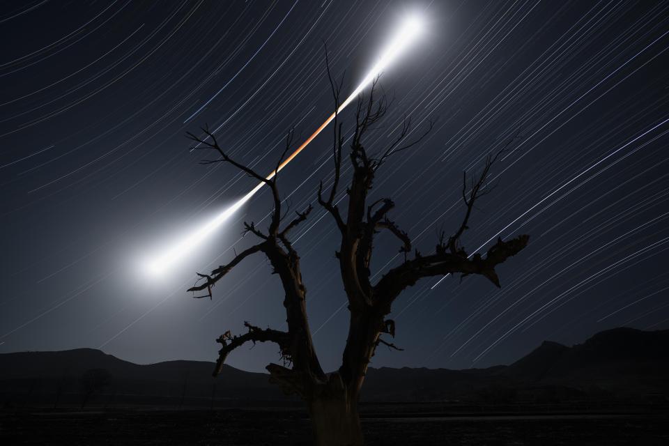  Chuanjin Su's mesmerising piece of an Eclipsed Moon Trail