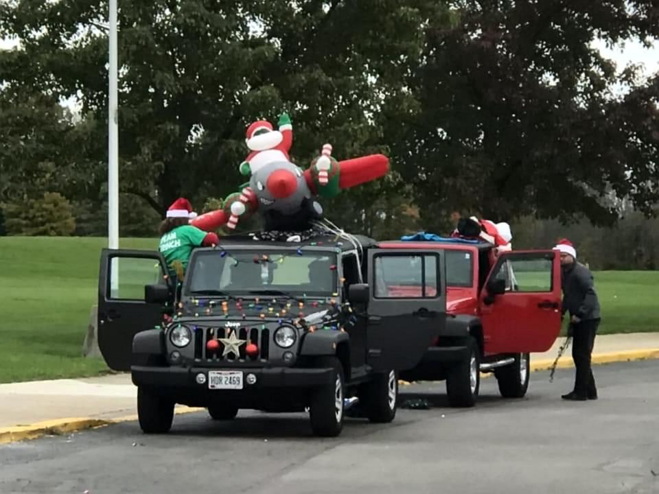  Jeeps featuring a Santa Claus inflatable paraded past Keith's house