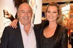 Kate Moss cuddles up to the business tycoon here goes cold in his defence