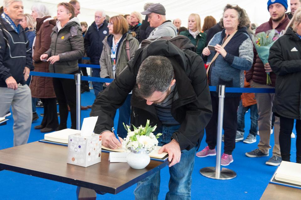 People queued up to sign their condolences 