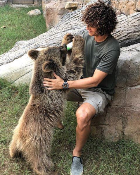 David Luiz shared this snap of him feeding a baby bear on to Instagram