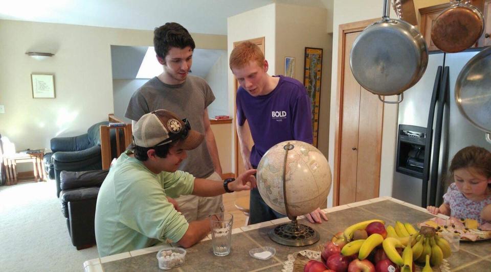  Chau, pictured sitting down on the left, tell his pals about his plans to visit the remote island