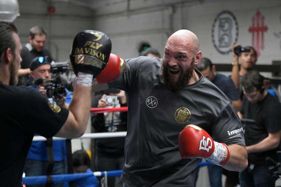  Fury hitting the pads during his open-workout with trainer Ben Davison at the Summit Gym in Big Bear, California