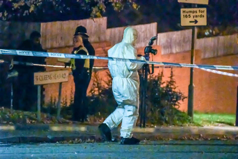  Forensic officers work at the scene of the shooting Birmingham