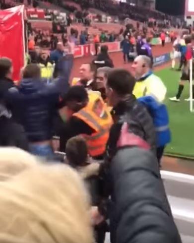 Stewards were forced into action and had to push several Boro fans back into the stand