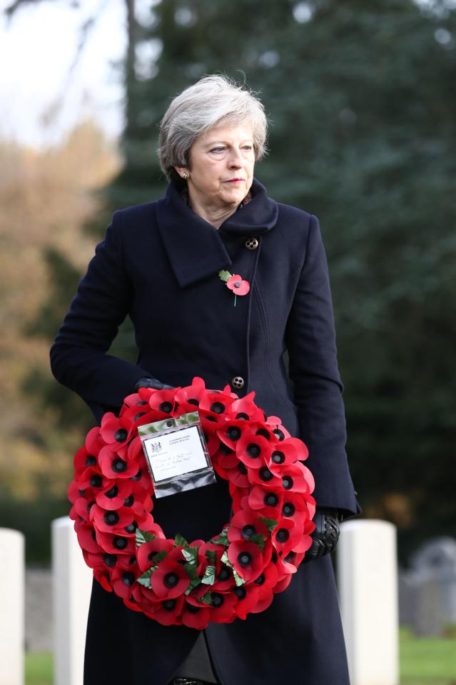  A solemn Theresa May remembered the Brits with the laying of wreaths