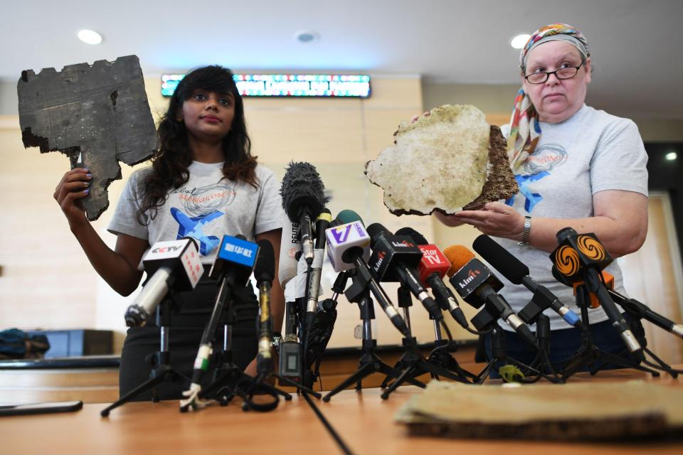  Grace Nathan, left, and Jacquita Gonzales present new bits of plane debris found washed up in Madagascar
