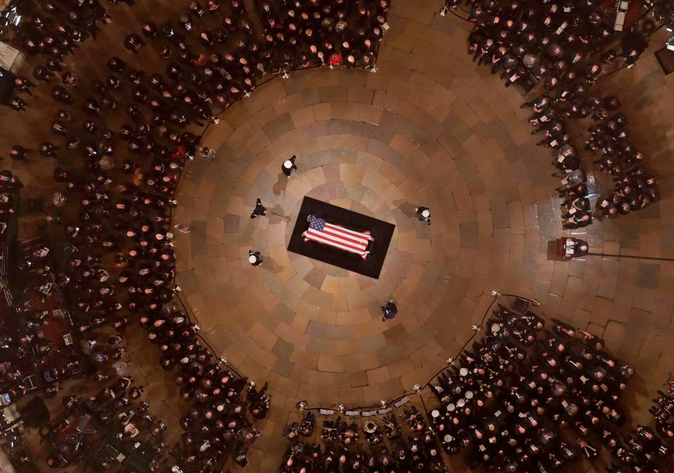  Senate Majority Leader Mitch McConnell speaks as George HW Bush lies inside the Rotunda
