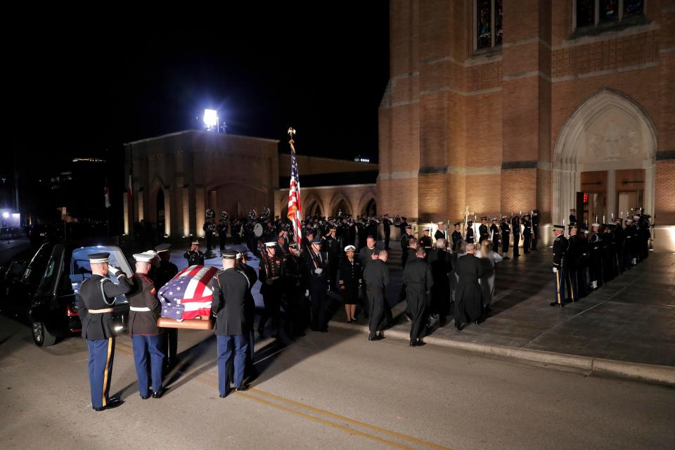  Hundreds of well-wishers watched the former Presidents final journey as a military band played