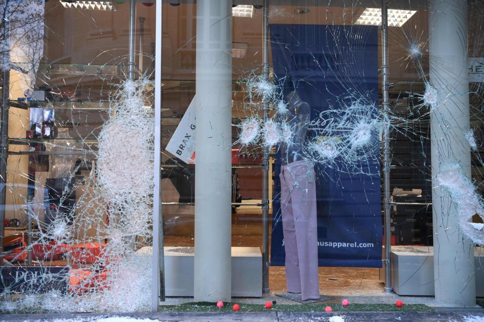  A picture taken on December 9, 2018 on Marceau avenue in Paris, shows a damaged golf shop window