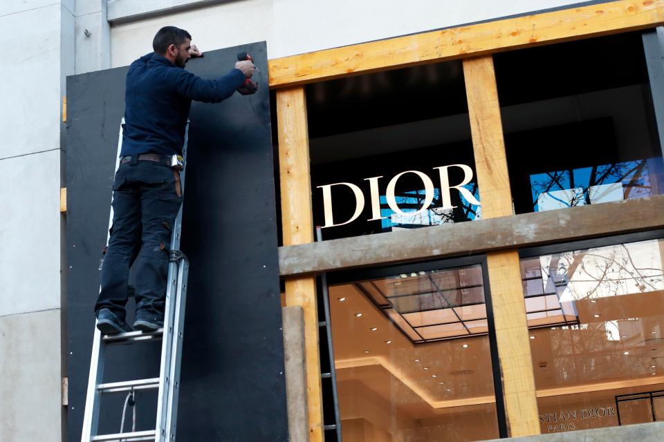  Many stores, including this Dior shop, have been preparing for such protests by boarding up windows