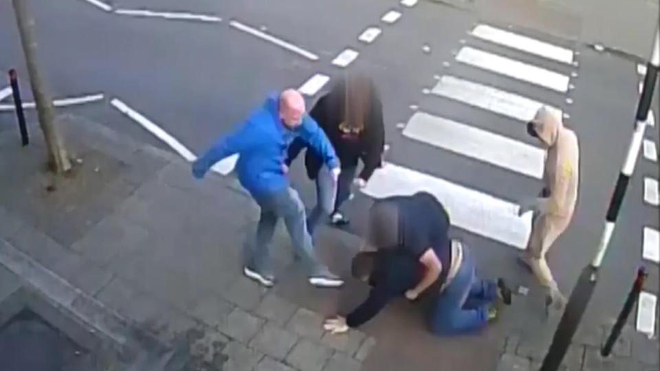  Scrapping hooligans kicked and punched each other on the ground after glass was thrown