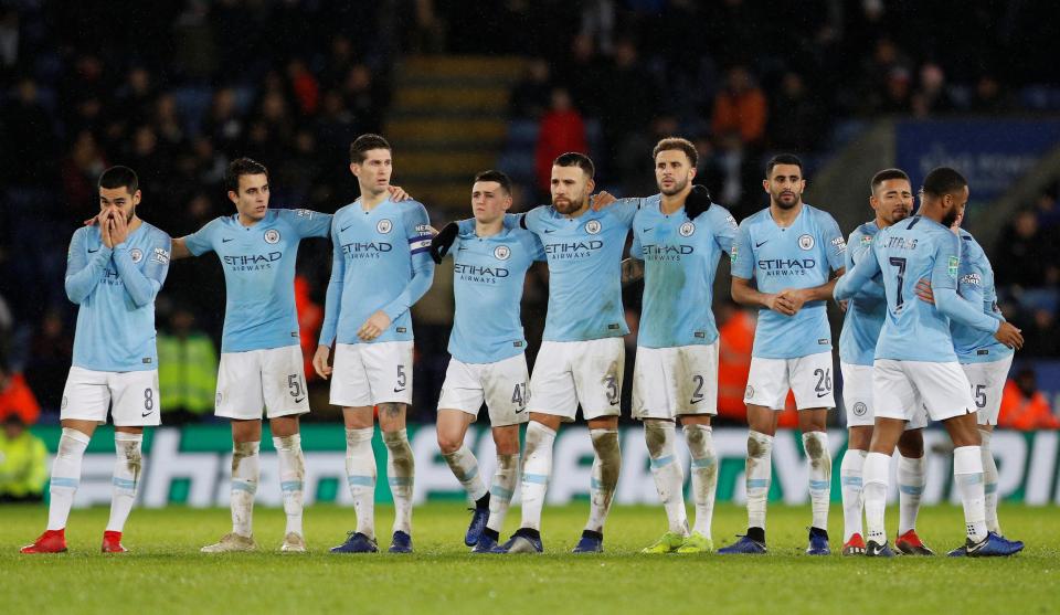 Manchester City's players line up during the penalty shoot out at the King Power