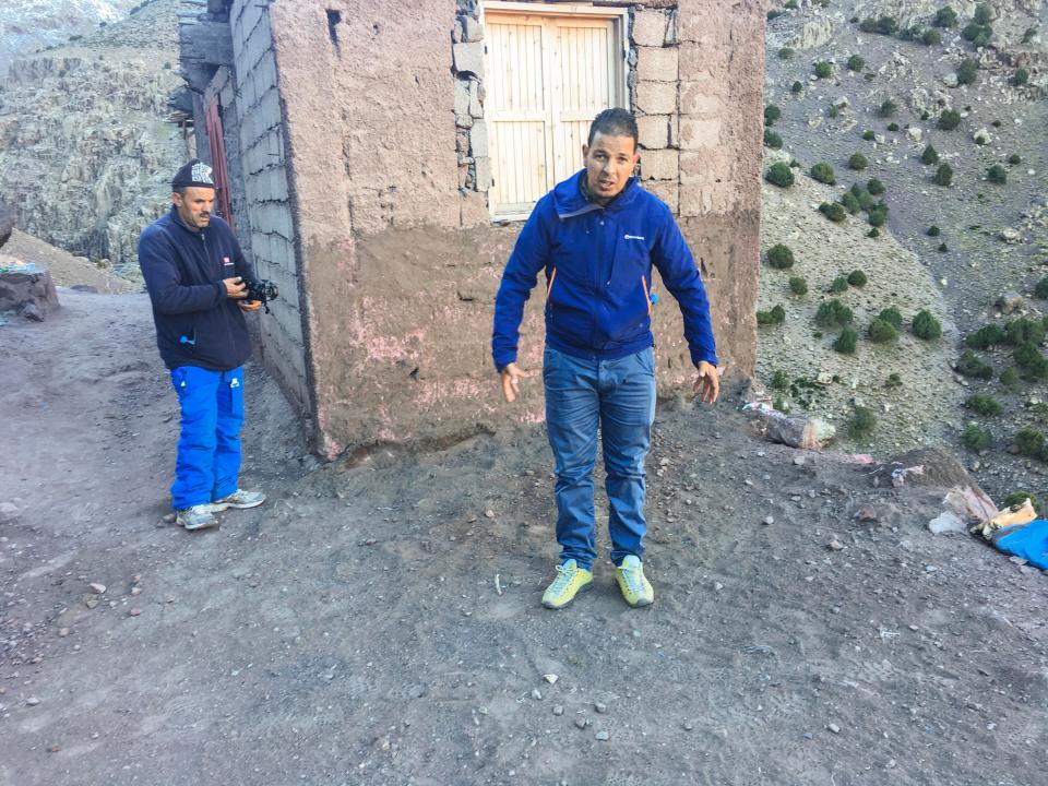  A guide stands at the site of the atrocities in Morocco's High Atlas mountains