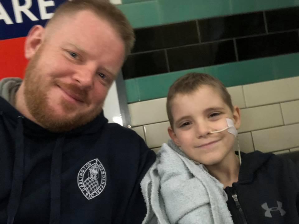 Luke with his father Mark who said his son had just been accepted for a trial for experimental treatment in Spain