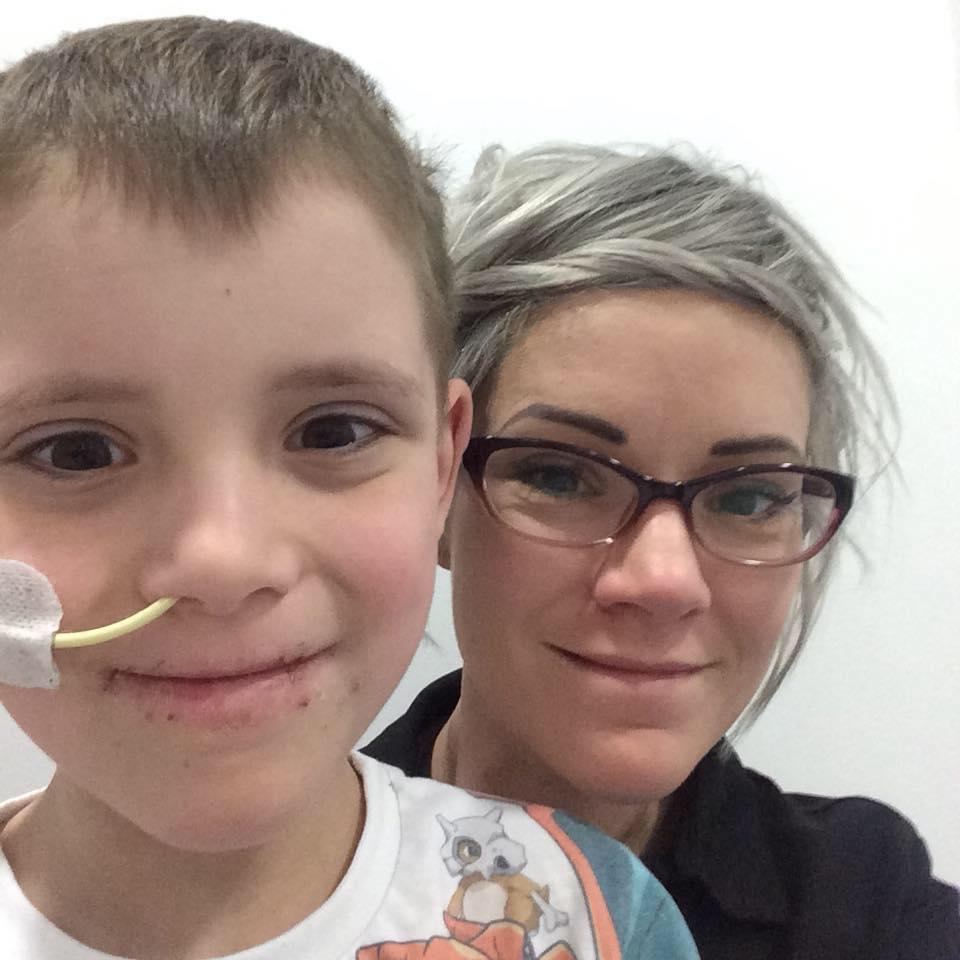 Eight-year-old Luke with his mum Becky 