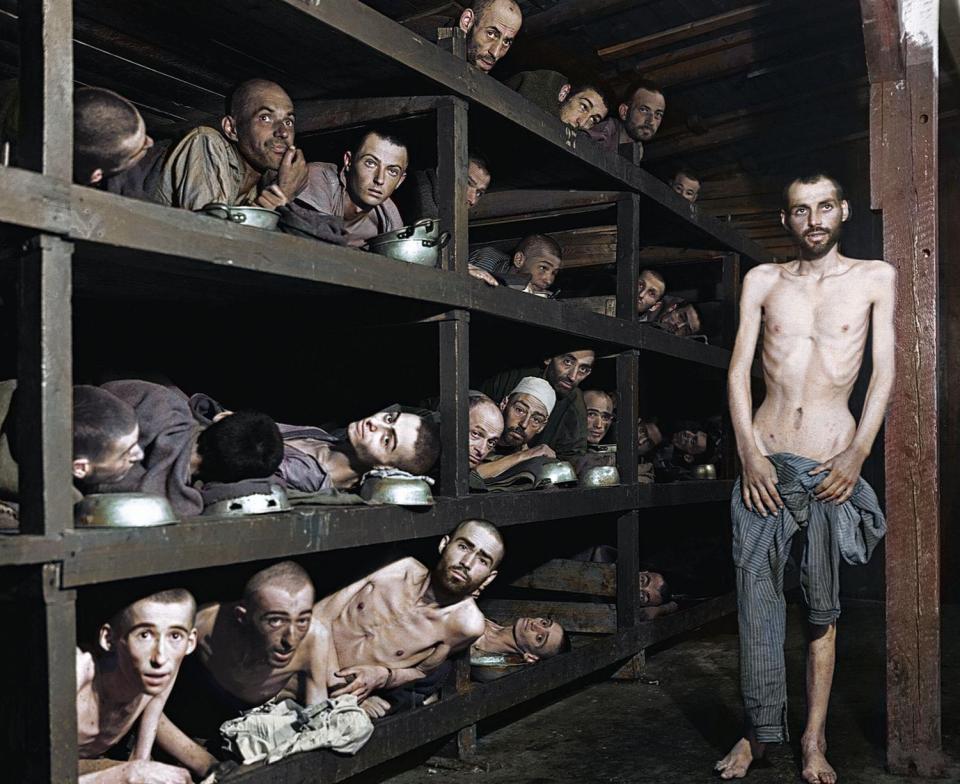 The horrors of the Holocaust are brought home in this horrifying photo of emaciated survivors after the liberation of Buchenwald Concentration Camp by the Allies in 1945