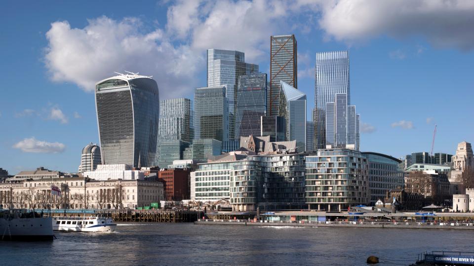  Fascinating mock photos reveal what London could look like by the year 2026 - here new structures including the Can of Ham and Scalpel can be seen from ground level facing north behind the River Thames