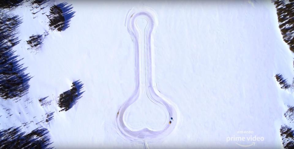 The boys even race cars around a penis-shaped racetrack carved in the snow 