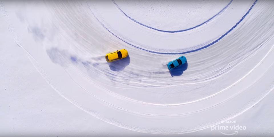 A Lamborghini and Porsche are put through their paces around a testicular curve