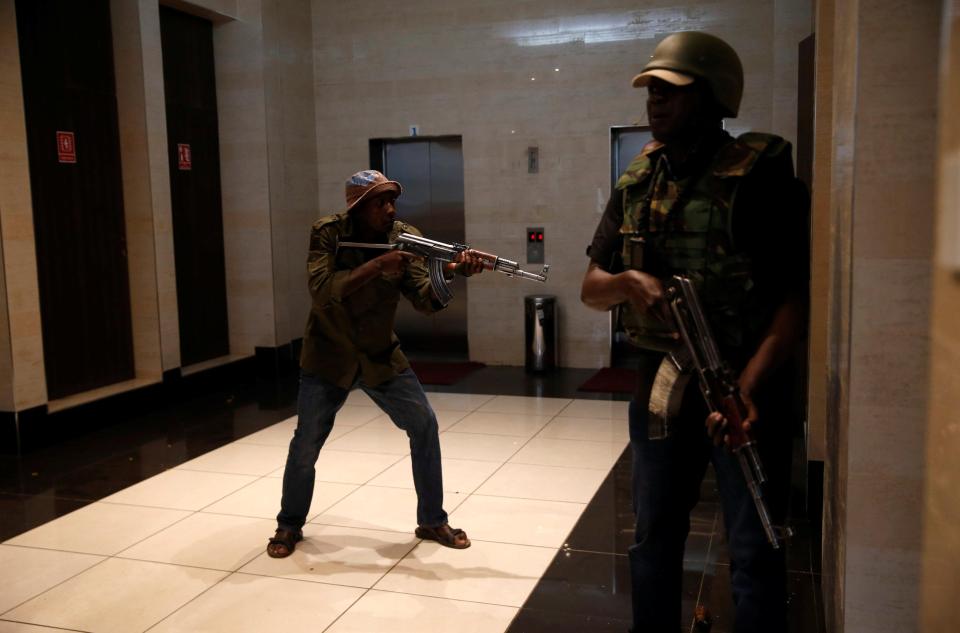 Members of security forces secure a building