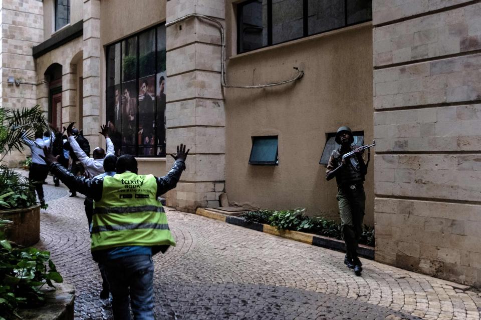 Others are seen fleeing after being rescued by security forces