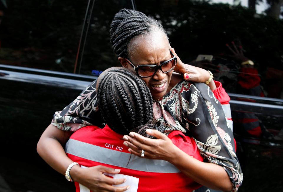 Two women hug at the scene of the deadly Al-Shabaab attack