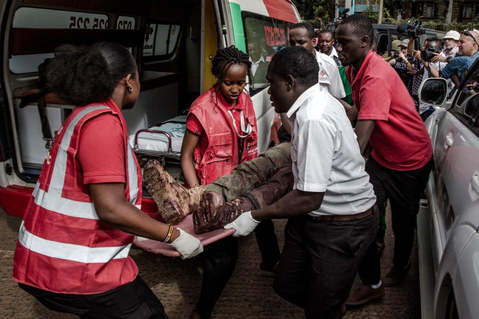  An injured member of the Kenyan security forces is evacuated