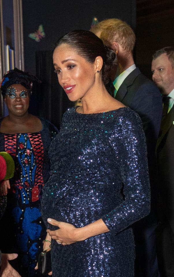  Meghan Markle was seen cradling her baby bump