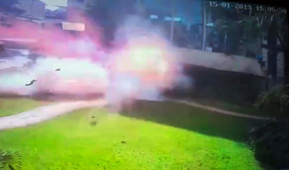In this image made from security camera video footage, a man blows himself up in a grassy area at the DusitD2, a luxury hotel and shopping complex in Nairobi, Kenya, on January 15