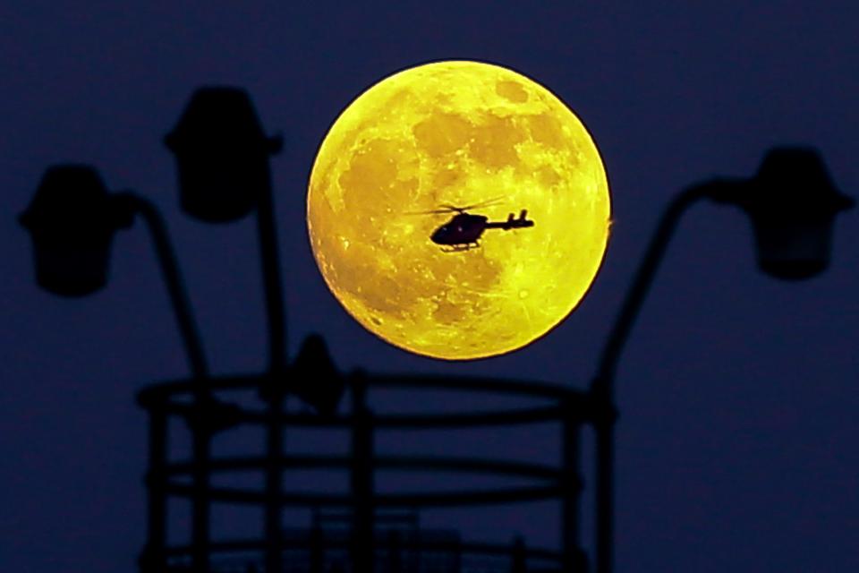  A helicopter is seen over January 2019's Wolf Moon in London