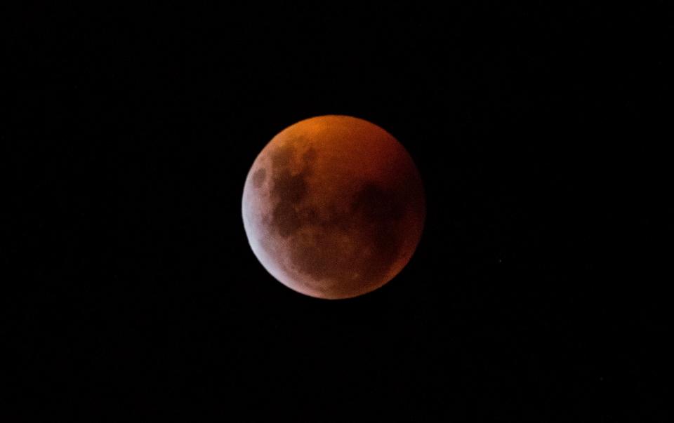  The so-called Super Blood Wolf Moon was engulfed into Earth's dark umbral shadow during a total lunar eclipse over Milan, north Italy