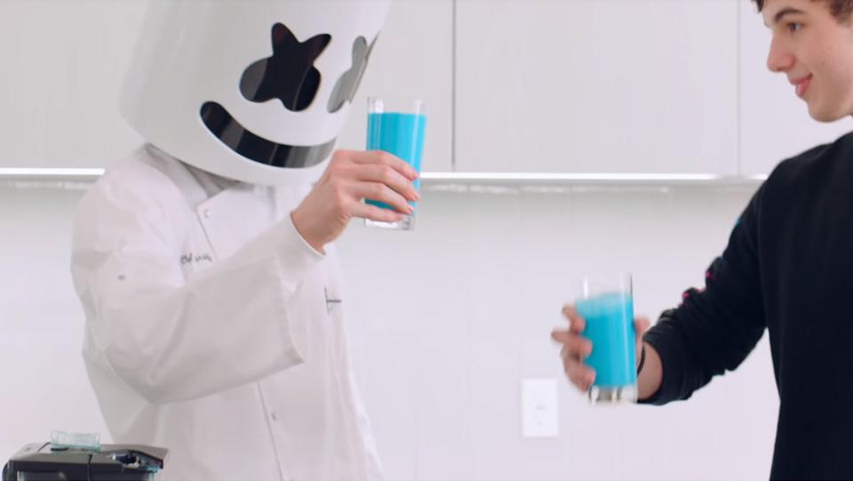  Marshmello (left) toasts with a glass of blue-dyed almond milk meant to represented a Fortnite chug jug