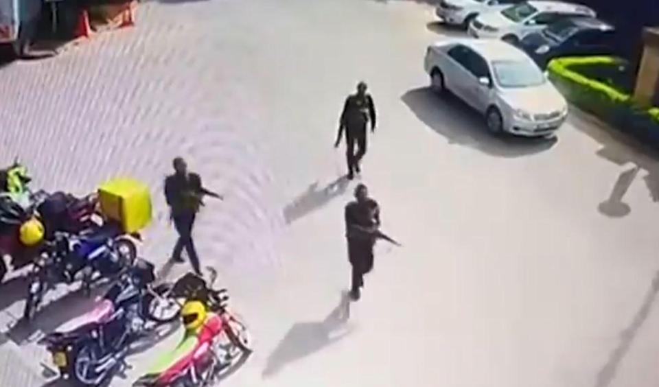 Chilling CCTV shows gun-wielding terrorists enter the hotel, before slaughtering 14 people - including a Brit and an American
