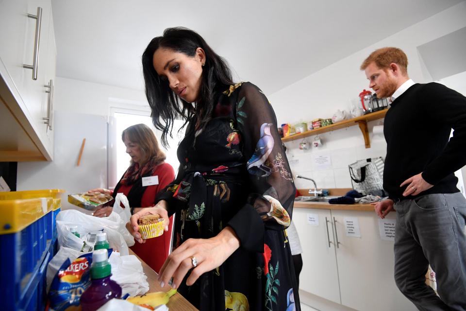 The Duke and Duchess of Sussex in the charity kitchen with volunteer Sue Creighton