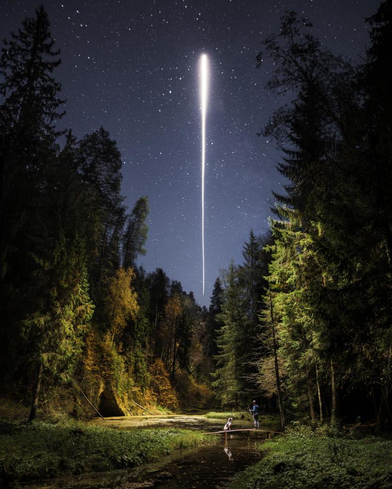 A dog and its best friend reveal the secrets that hide in the dark in Cīrulīši nature trail, Gauja National Park, Latvia