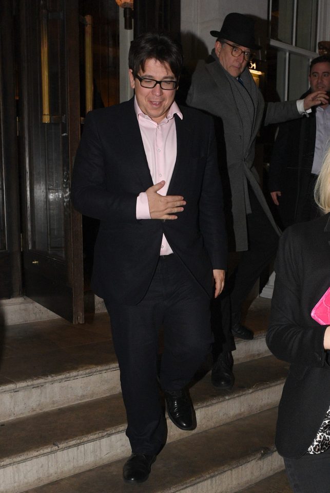  Michael looked dapper in a black suit with a pink shirt
