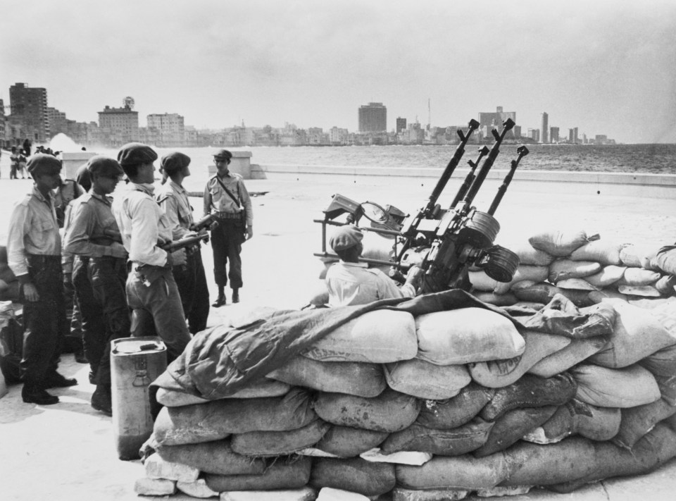  Cuban soldiers stand by an anti-aircraft artillery at the Havana waterfront over fears of an invasion from the US