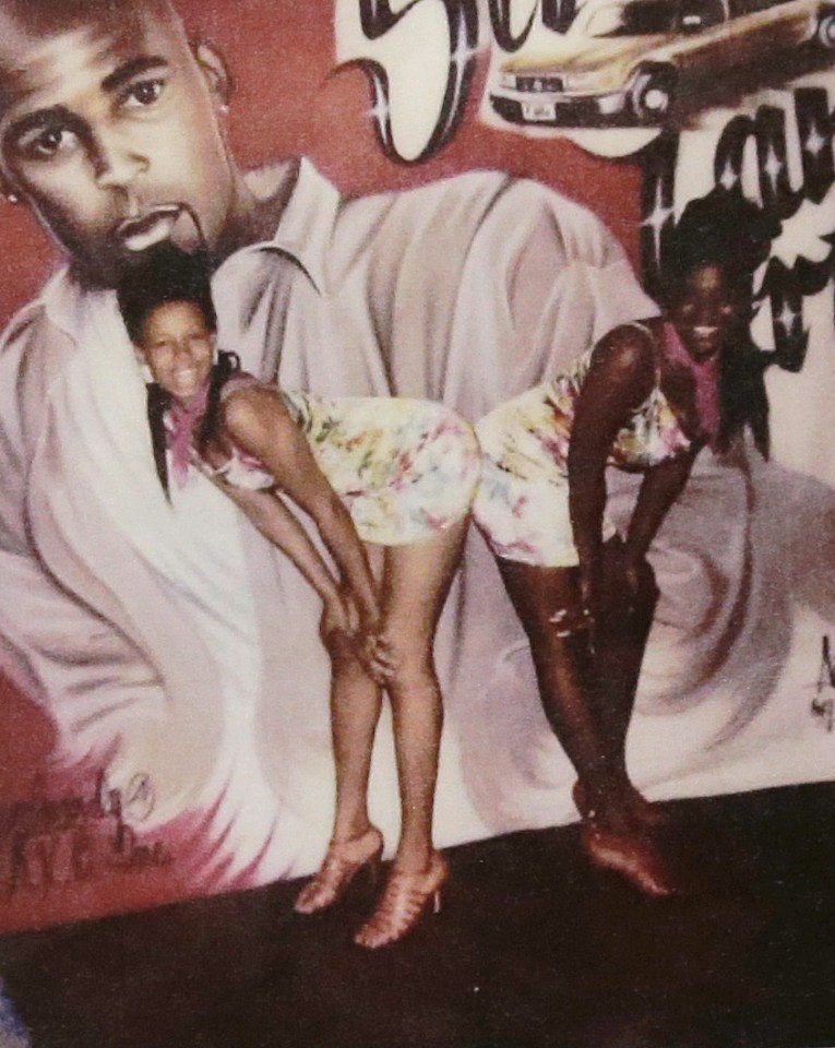  Latresa Scaff, left and Rochelle Washington, posing in front of a picture of R Kelly on the night they claim he assaulted them
