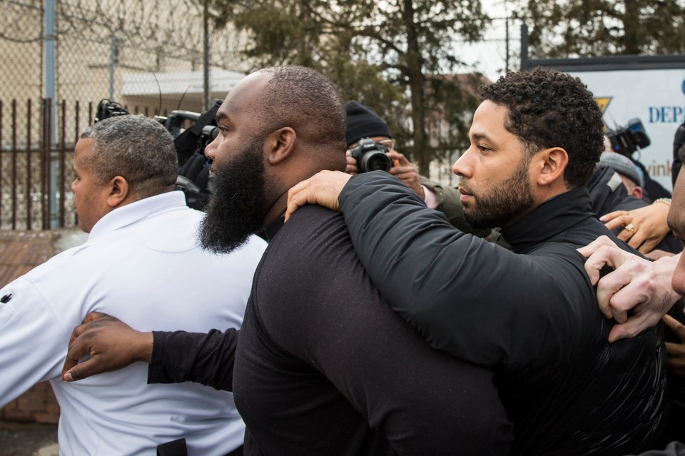  Smollett, right, leaves Cook County jail following his release